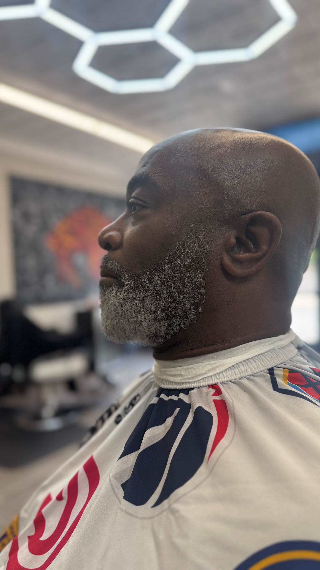 Clean head shave with beard detail by Tony's Beard ℰ Cuts