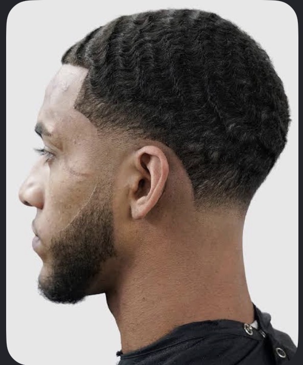 Low taper fade with clean razor line-up by Tony Cutz